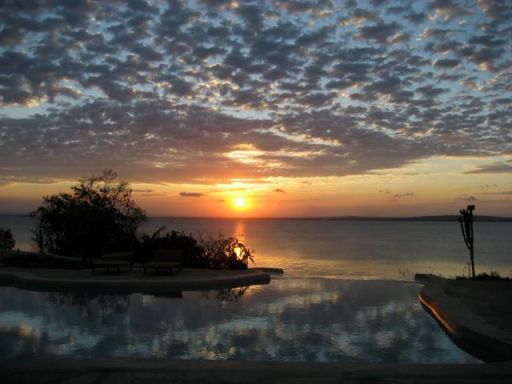 Where the water's like a mirror to the sky.